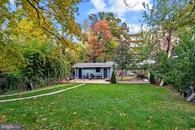 a view of a house with a yard porch and sitting area