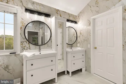 a kitchen with stainless steel appliances granite countertop a sink stove and microwave