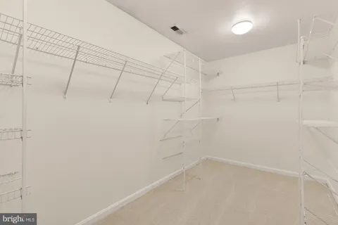 a kitchen with stainless steel appliances a stove a sink and a microwave