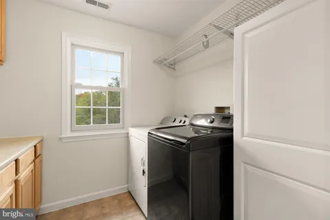 a view of a balcony with wooden floor and fence