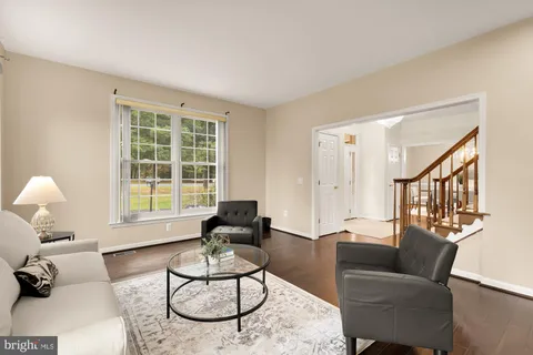 a view of a dining room with furniture and window