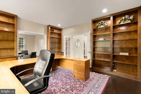 a kitchen with a stove a refrigerator and furniture