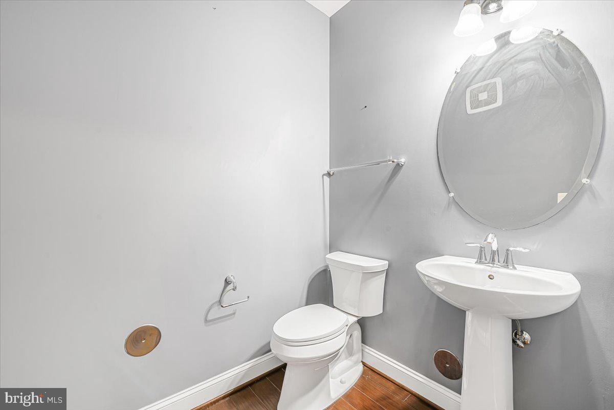 3911 Doc Berlin Drive, Unit 14 Silver Spring, MD 20906 - Photo 11 of 33 a bathroom with a sink a mirror and toilet