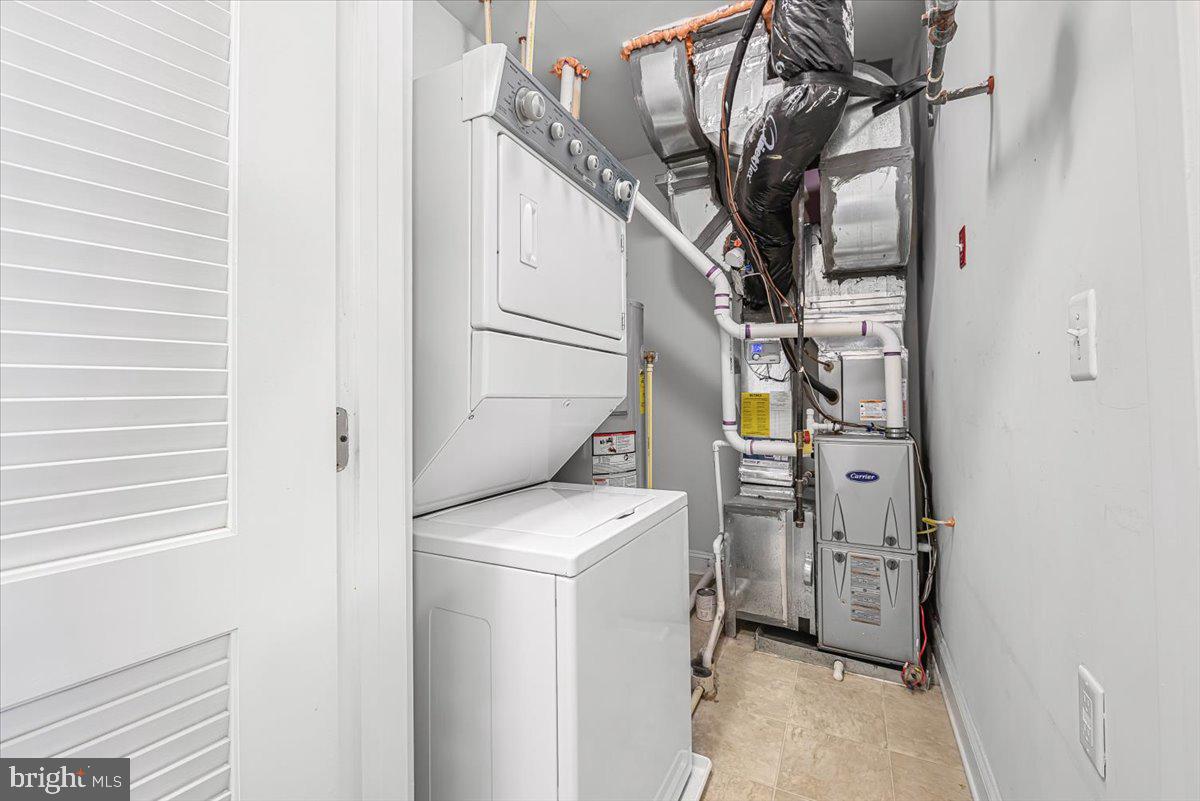 3911 Doc Berlin Drive, Unit 14 Silver Spring, MD 20906 - Photo 12 of 33 a utility room with dryer and washer