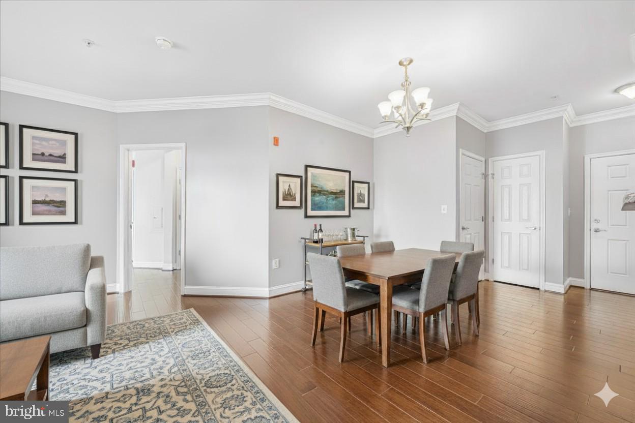 3911 Doc Berlin Drive, Unit 14 Silver Spring, MD 20906 - Photo 19 of 33 a view of a dining room with furniture window and wooden floor