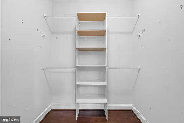 a view of an empty walk in closet