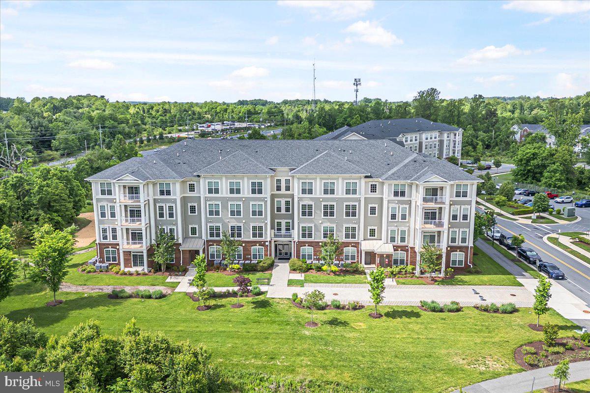 3911 Doc Berlin Drive, Unit 14 Silver Spring, MD 20906 - Photo 2 of 33 a view of a house with swimming pool and yard