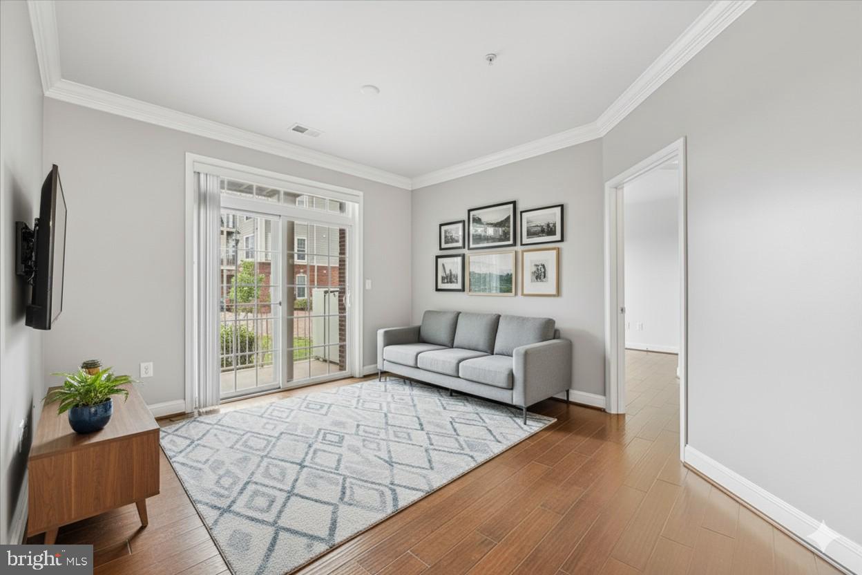 3911 Doc Berlin Drive, Unit 14 Silver Spring, MD 20906 - Photo 21 of 33 a living room with furniture and a flat screen tv