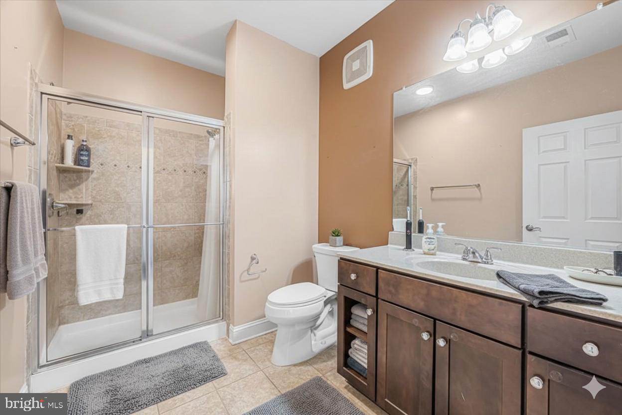 3911 Doc Berlin Drive, Unit 14 Silver Spring, MD 20906 - Photo 25 of 33 a bathroom with a sink a toilet and shower