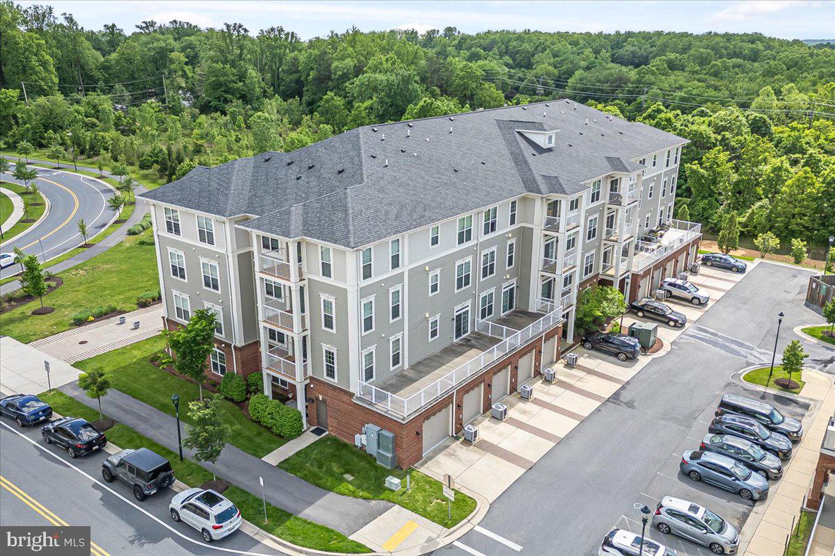 3911 Doc Berlin Drive, Unit 14 Silver Spring, MD 20906 - Photo 32 of 33 a aerial view of a house next to a yard