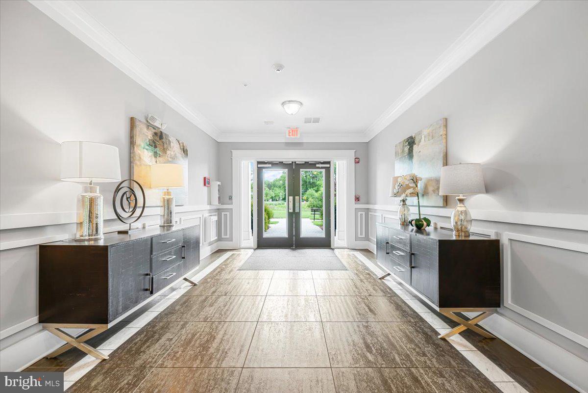 3911 Doc Berlin Drive, Unit 14 Silver Spring, MD 20906 - Photo 6 of 33 a kitchen with granite countertop a stove top oven sink and cabinets
