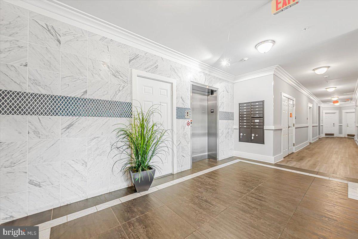 3911 Doc Berlin Drive, Unit 14 Silver Spring, MD 20906 - Photo 7 of 33 a view of a room with wooden floor and potted plant