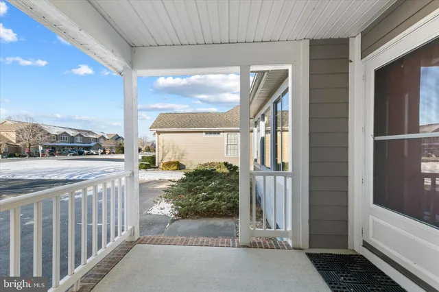 a view of a dining room with furniture and window
