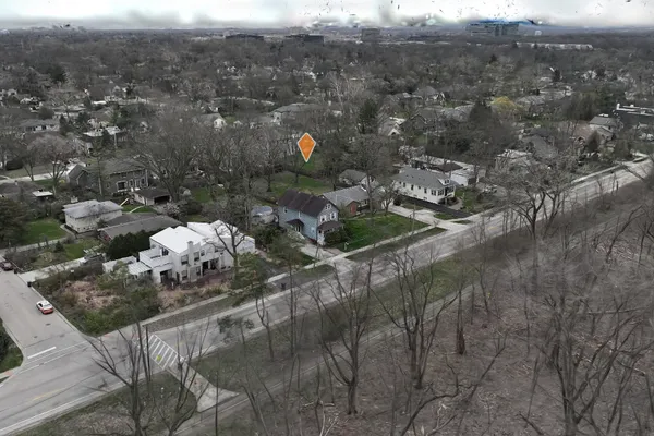 an aerial view of house with yard