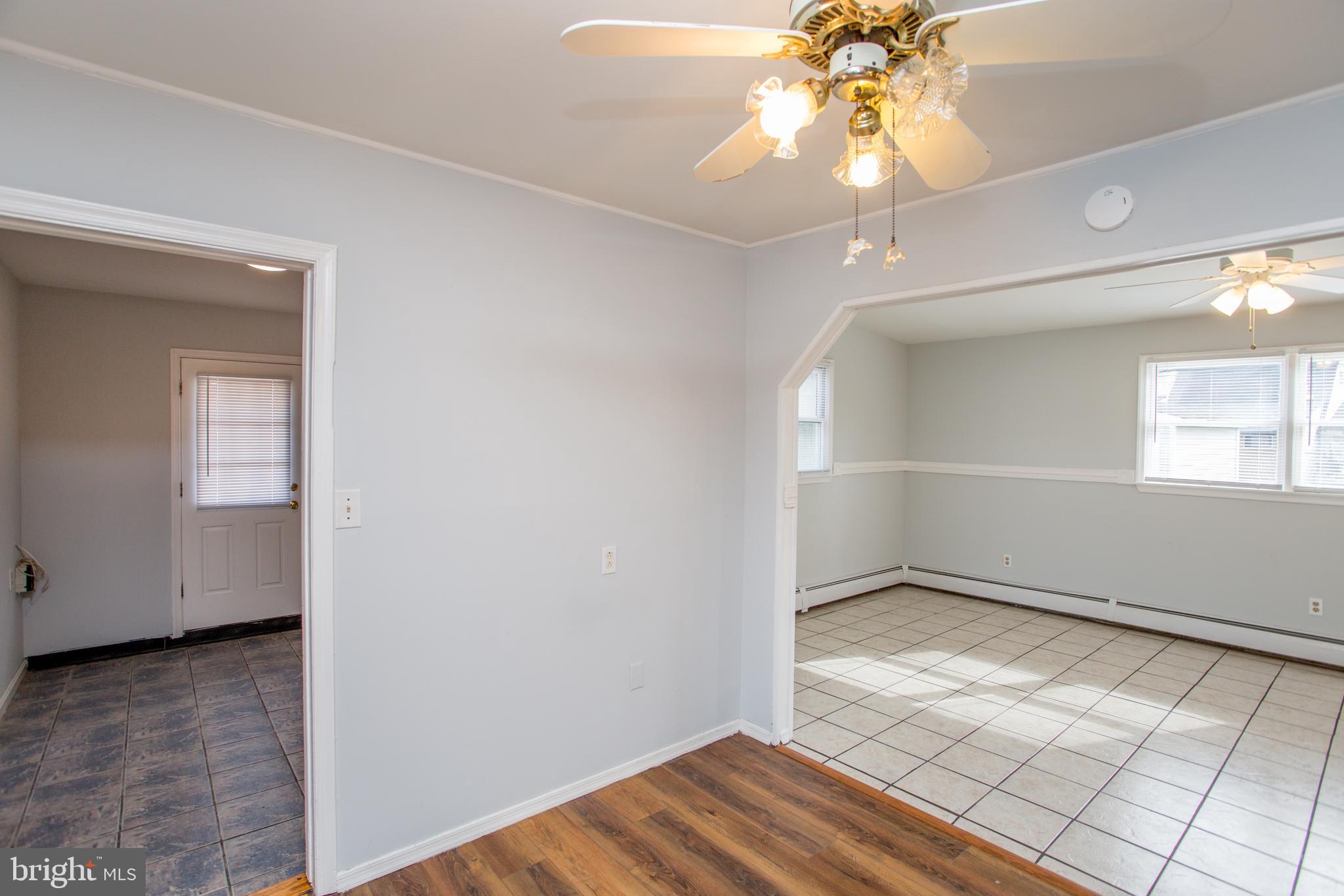 23 Misty Pine Road Levittown, PA 19056 - Photo 20 of 74 wooden floor in an empty room with a window