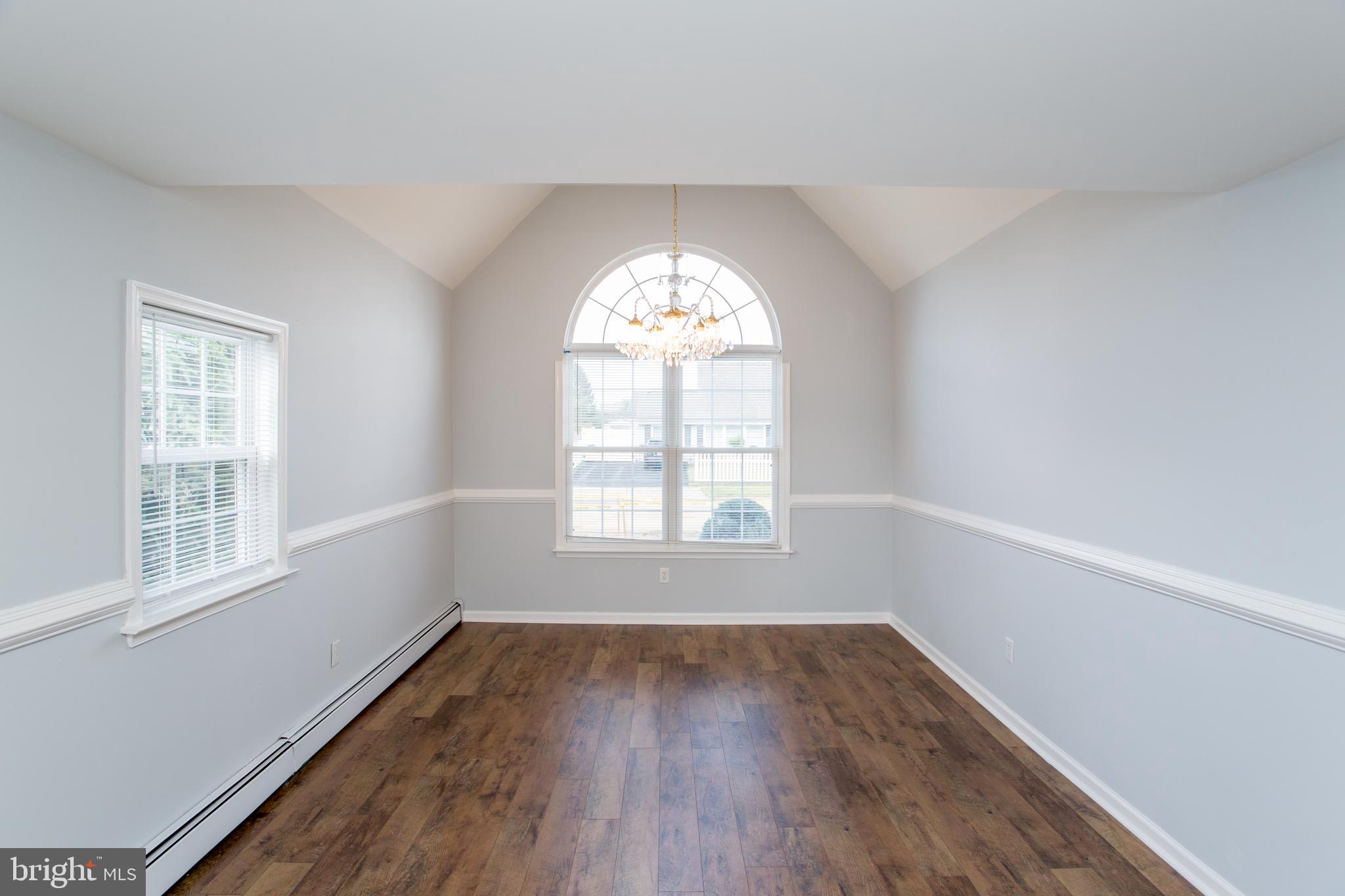 23 Misty Pine Road Levittown, PA 19056 - Photo 25 of 74 an empty room with wooden floor and windows
