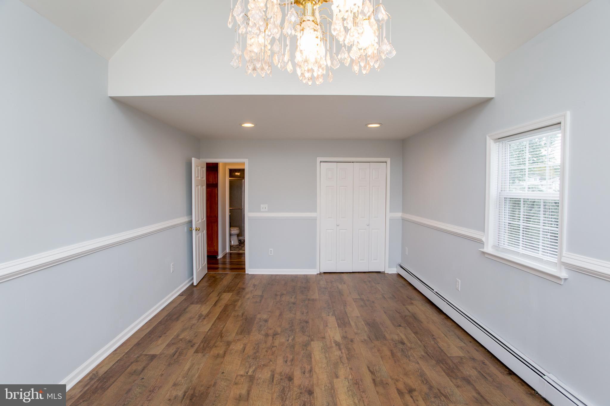 23 Misty Pine Road Levittown, PA 19056 - Photo 26 of 74 wooden floor in an empty room with a window