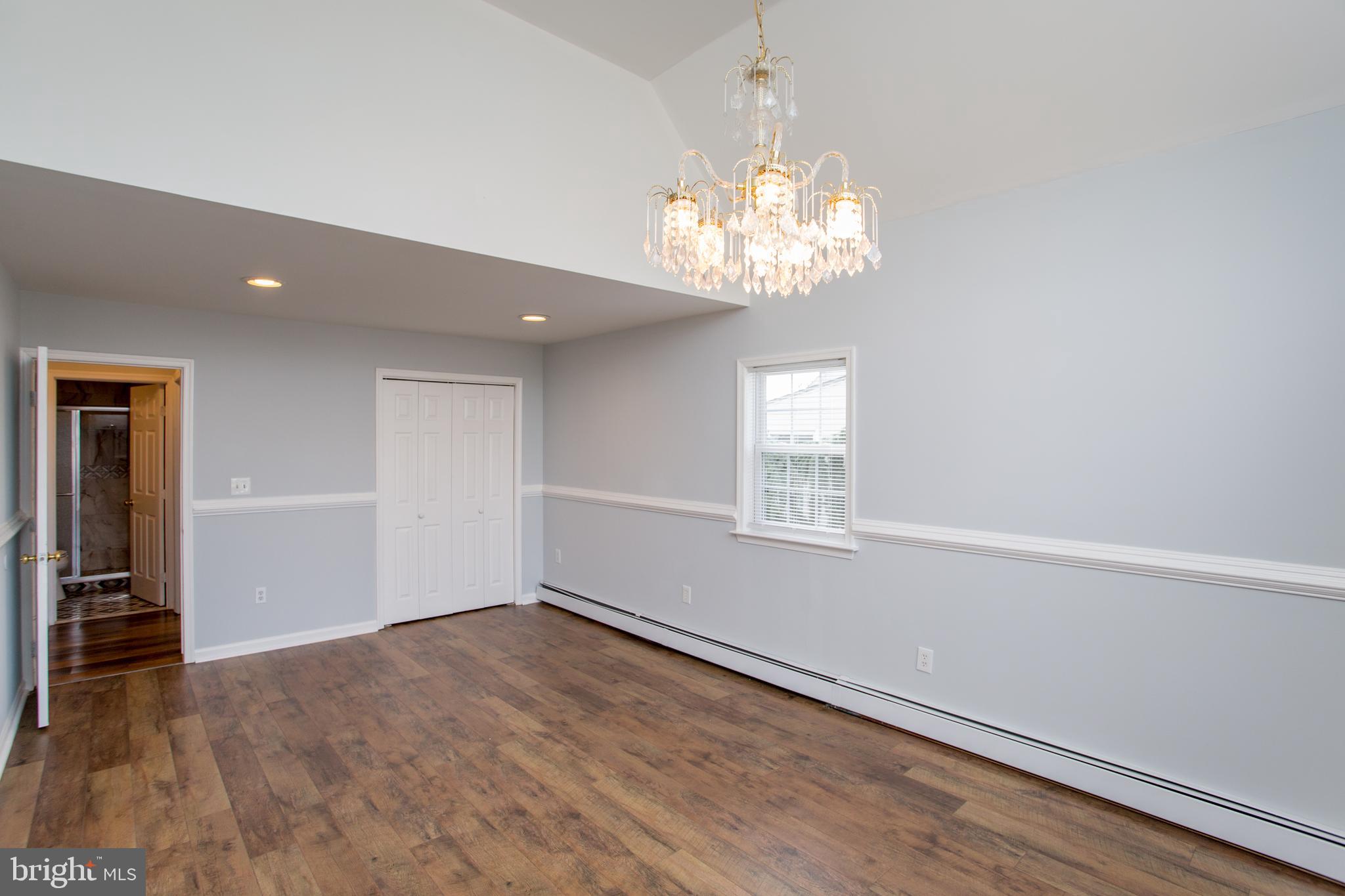 23 Misty Pine Road Levittown, PA 19056 - Photo 27 of 74 wooden floor in an empty room with a window