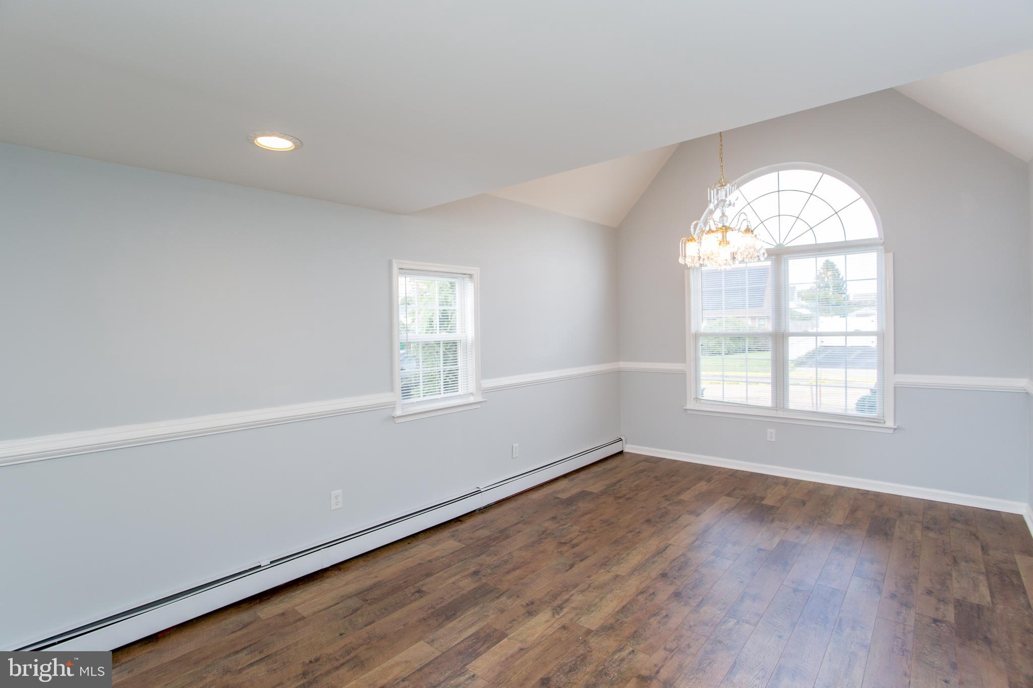 23 Misty Pine Road Levittown, PA 19056 - Photo 29 of 74 an empty room with wooden floor and windows