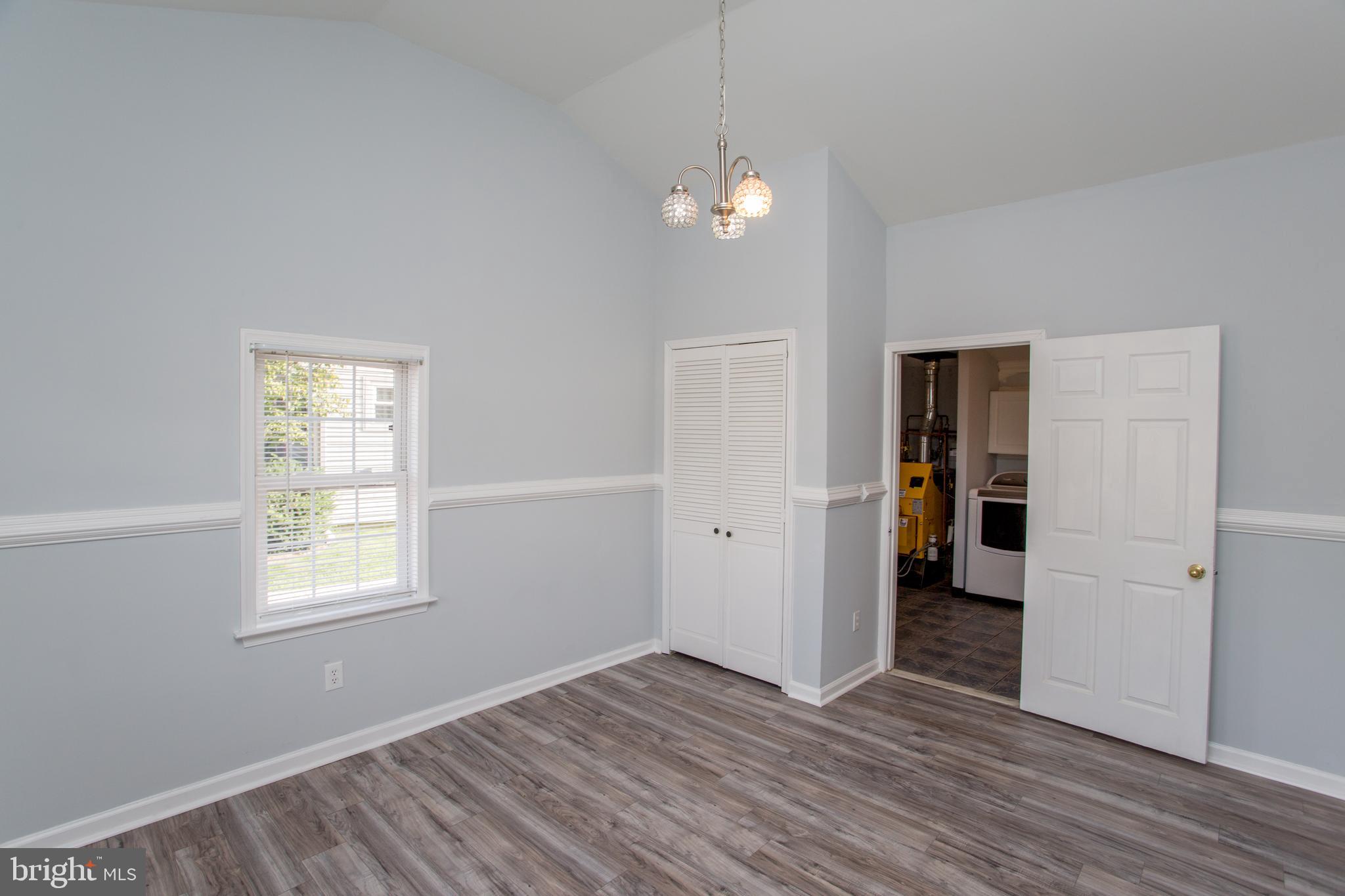 23 Misty Pine Road Levittown, PA 19056 - Photo 31 of 74 an empty room with wooden floor and windows
