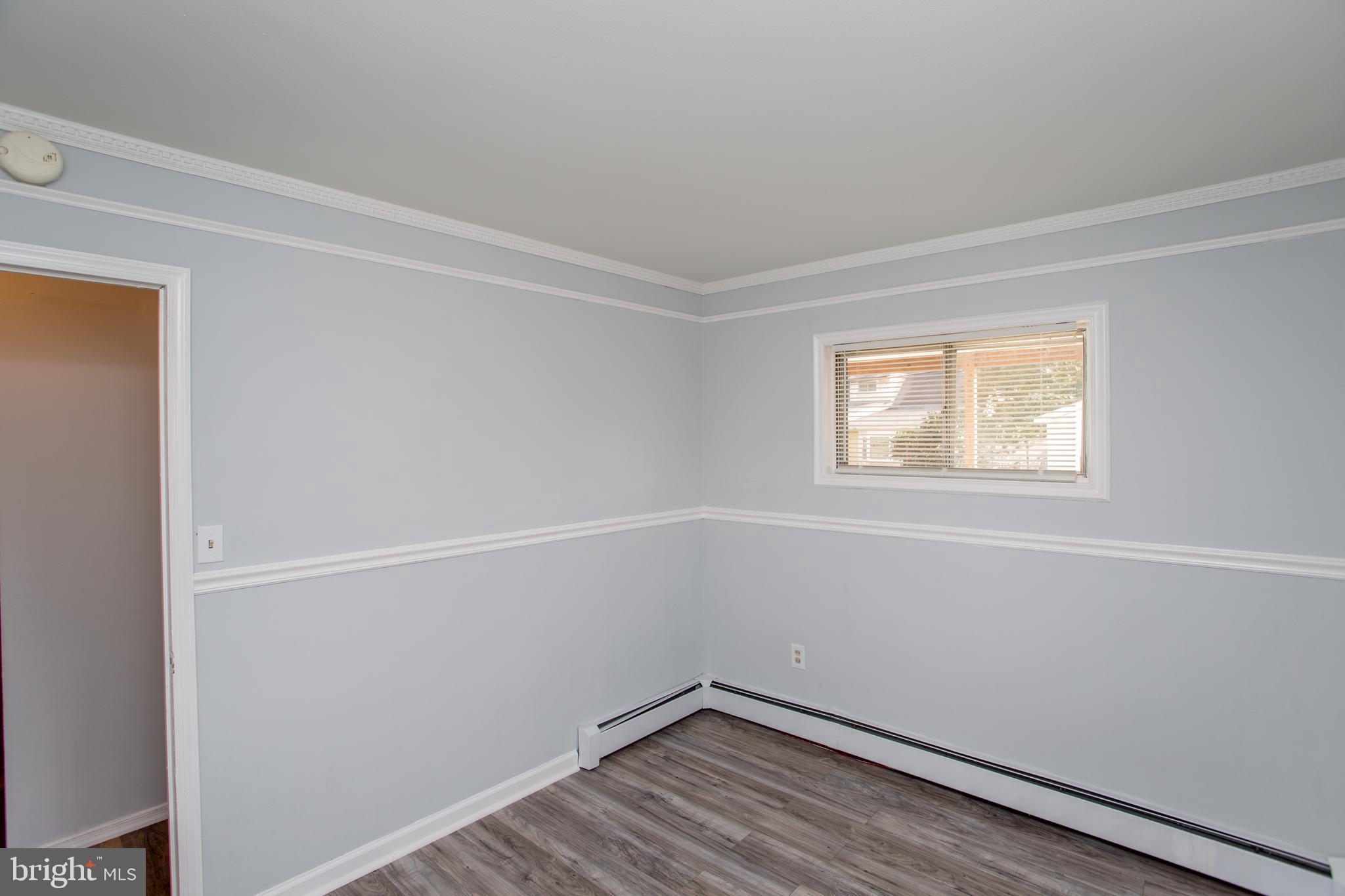23 Misty Pine Road Levittown, PA 19056 - Photo 32 of 74 a view of a small space with wooden floor and a window