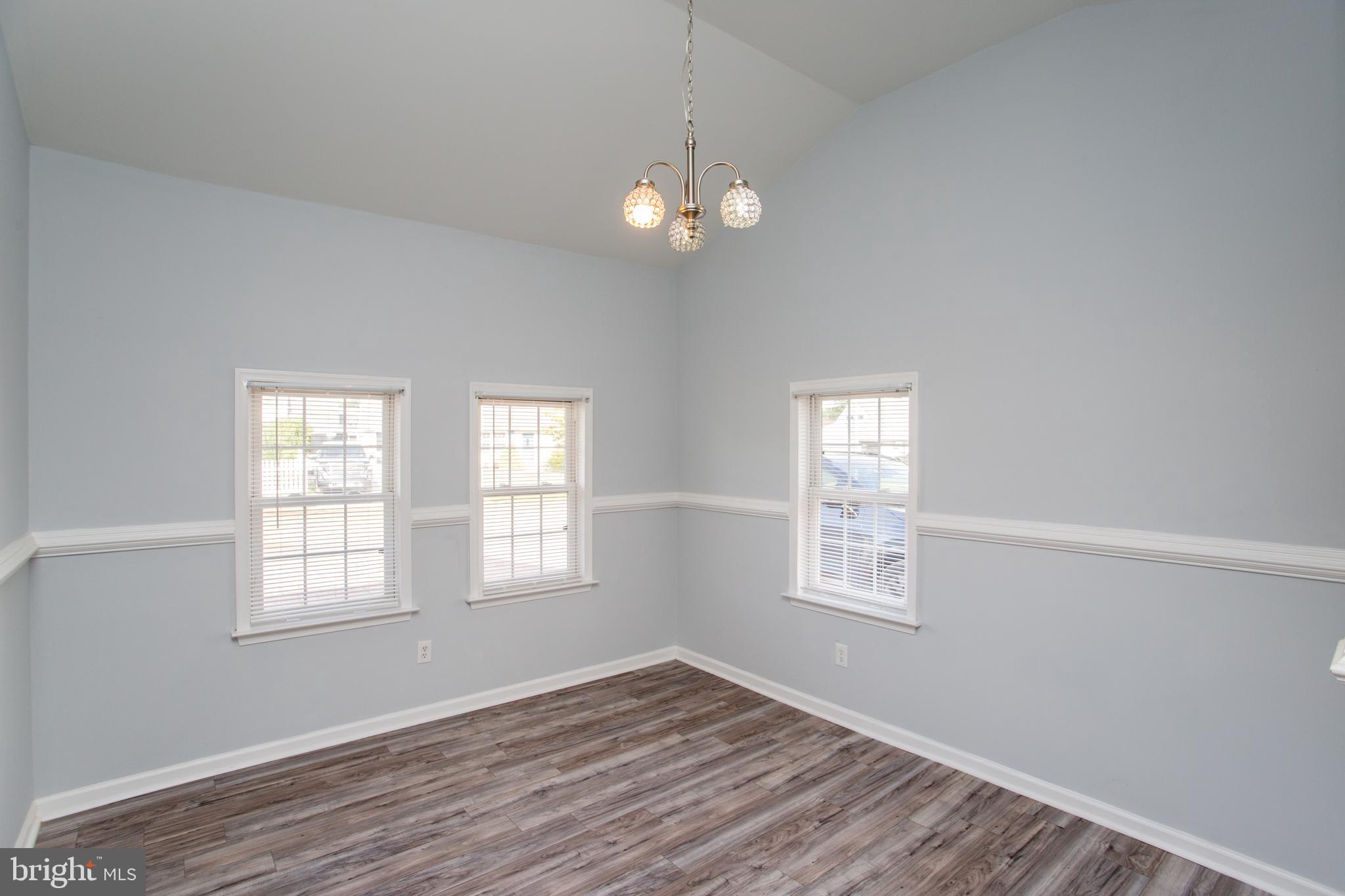 23 Misty Pine Road Levittown, PA 19056 - Photo 33 of 74 a view of an empty room with wooden floor and a window