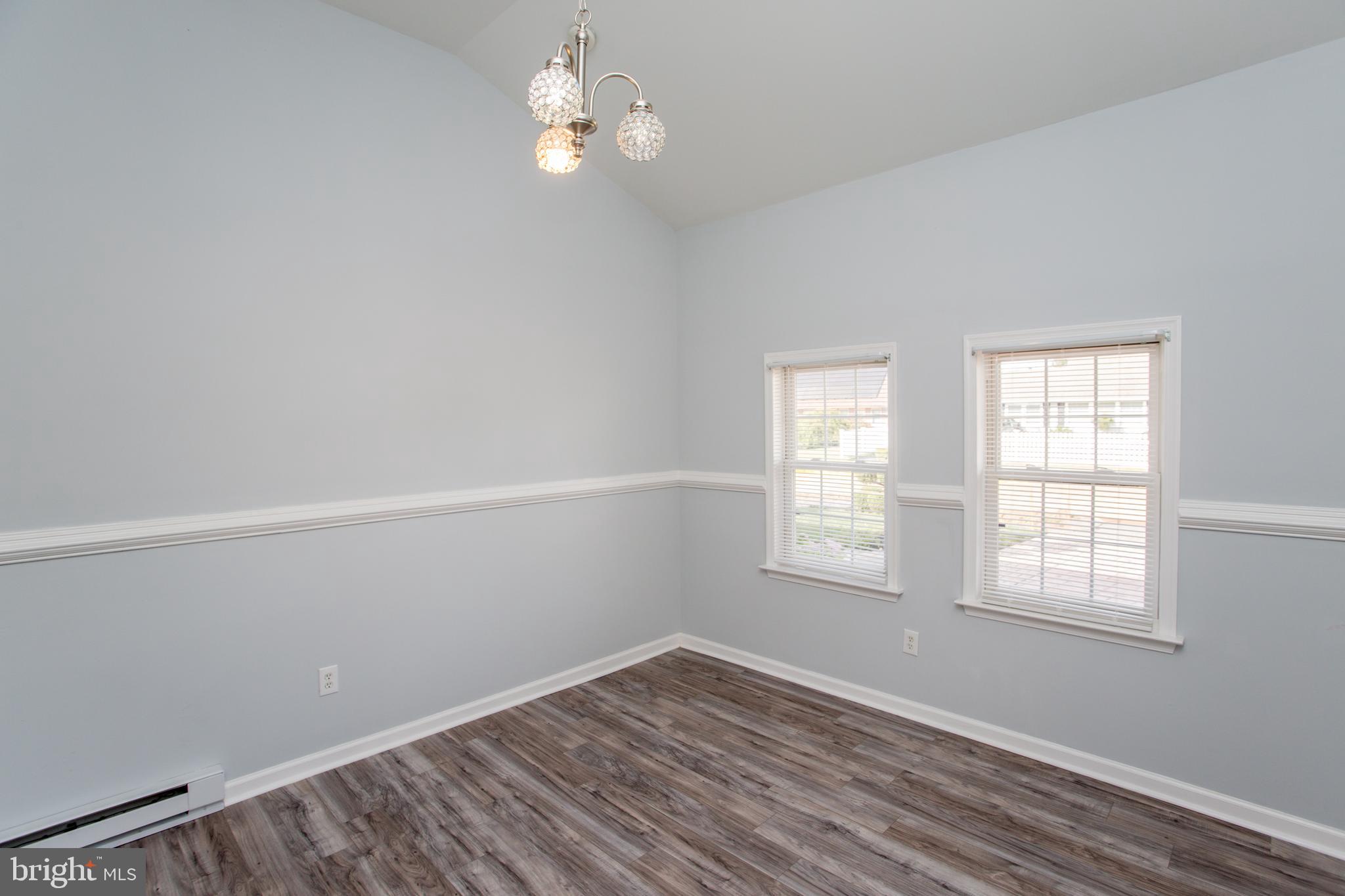 23 Misty Pine Road Levittown, PA 19056 - Photo 34 of 74 an empty room with wooden floor and windows