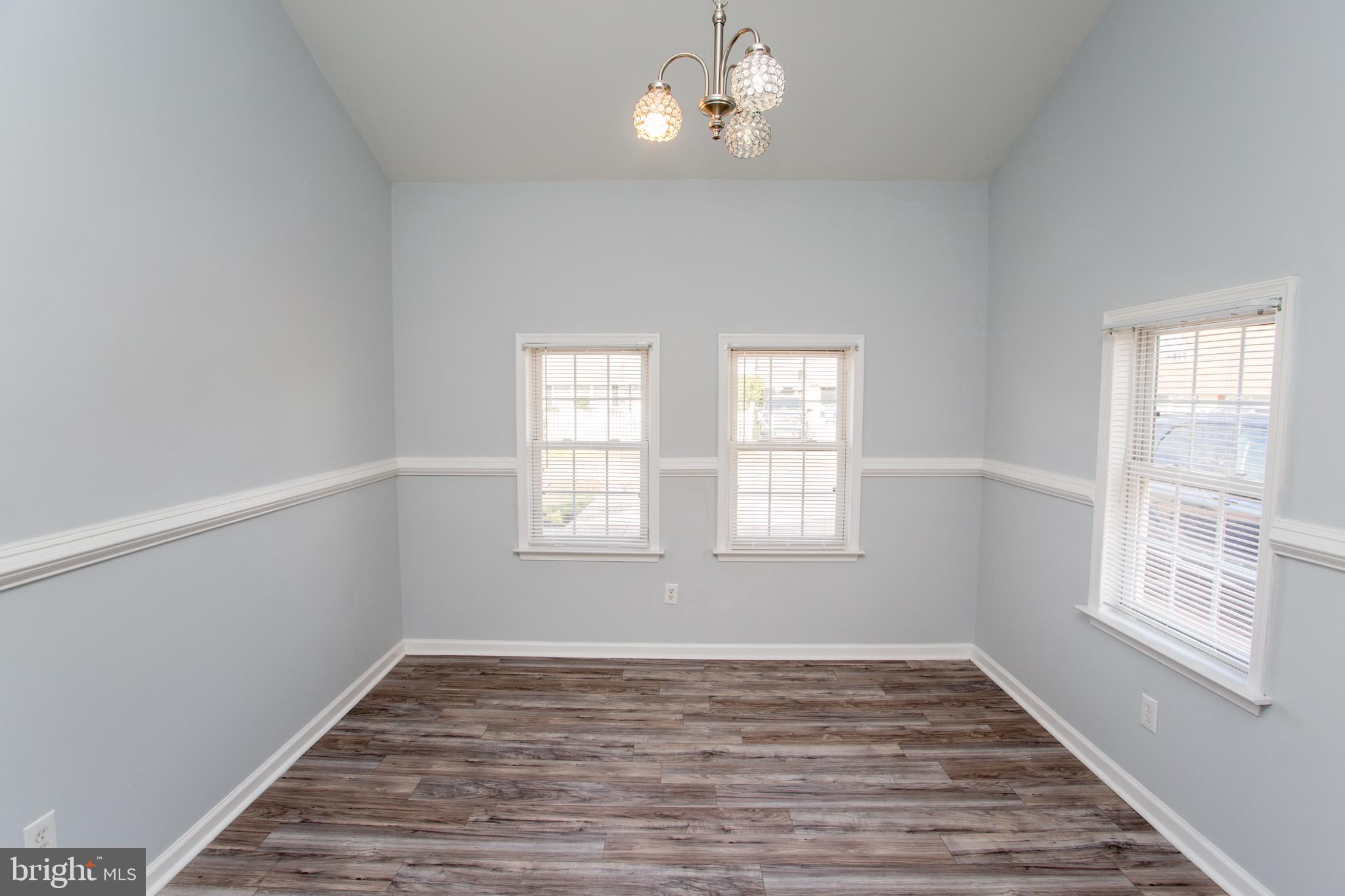 23 Misty Pine Road Levittown, PA 19056 - Photo 35 of 74 a view of an empty room with wooden floor and a window
