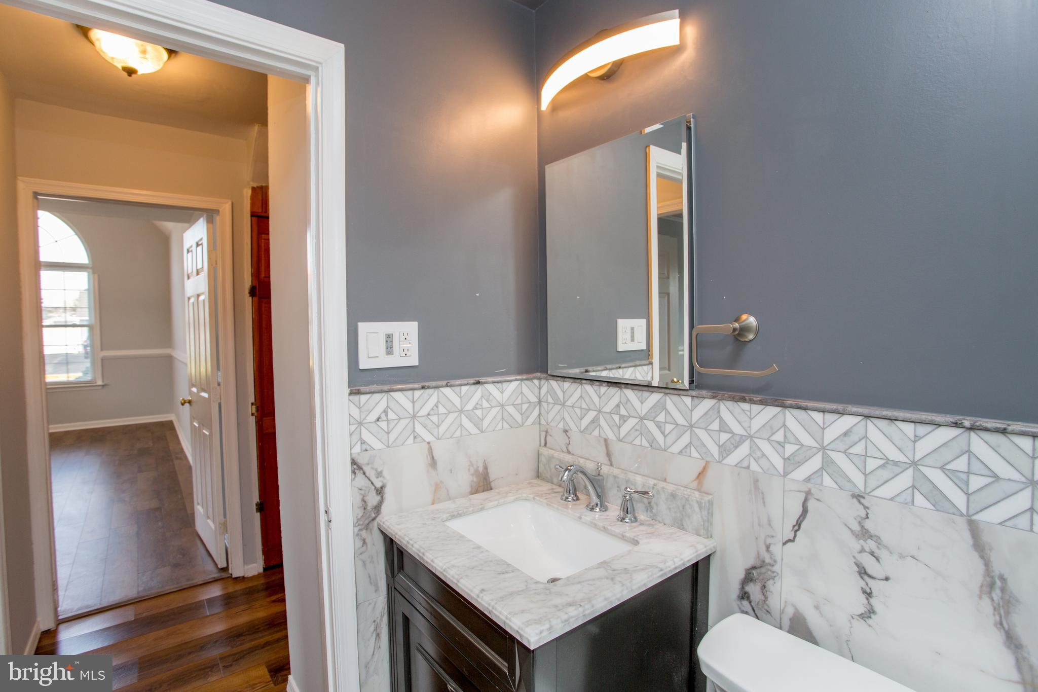 23 Misty Pine Road Levittown, PA 19056 - Photo 38 of 74 a bathroom with a sink and a mirror