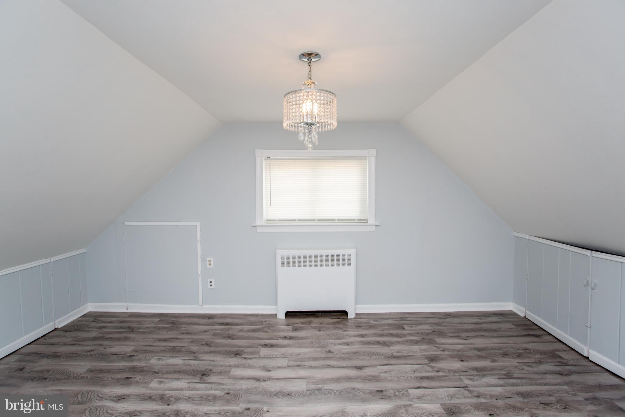 23 Misty Pine Road Levittown, PA 19056 - Photo 40 of 74 a view of an empty room with wooden floor and a window