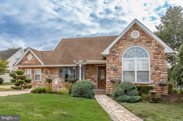 a front view of a house with a glass door