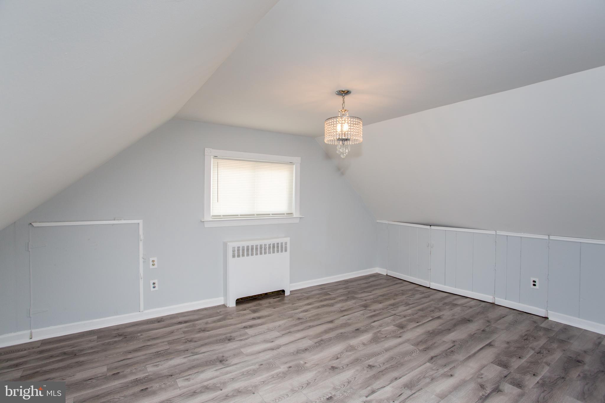 23 Misty Pine Road Levittown, PA 19056 - Photo 41 of 74 a view of an empty room with wooden floor and a window