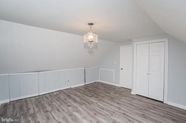 a view of a house with backyard and garden