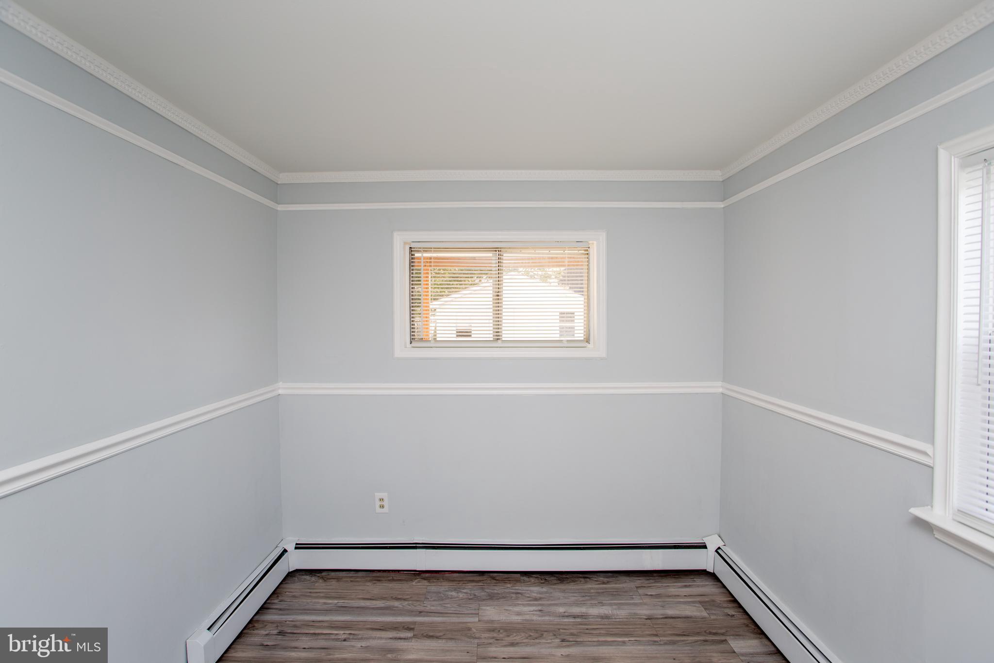 23 Misty Pine Road Levittown, PA 19056 - Photo 47 of 74 wooden floor in an empty room with a window