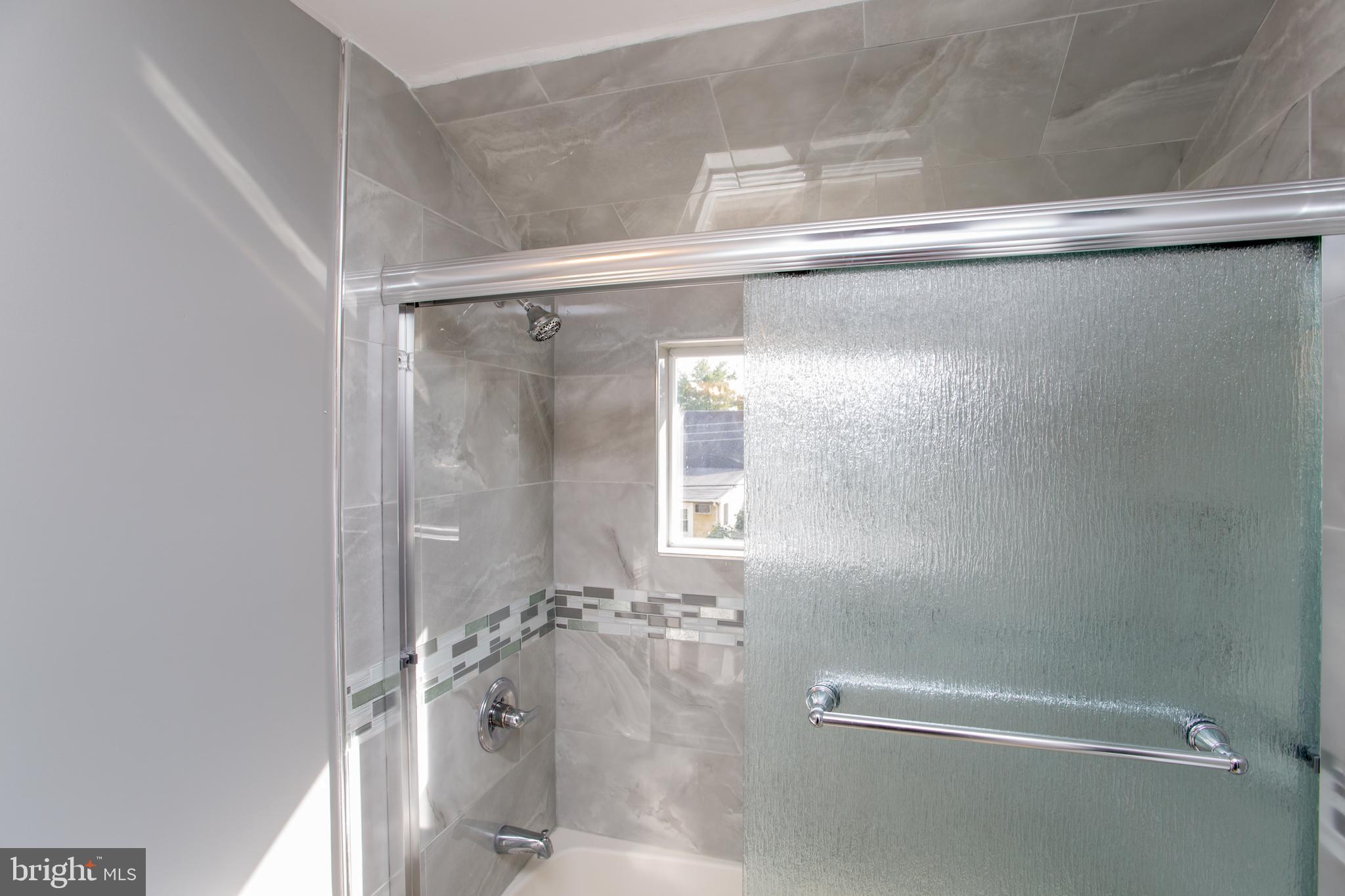 23 Misty Pine Road Levittown, PA 19056 - Photo 50 of 74 a bathroom with a glass shower door