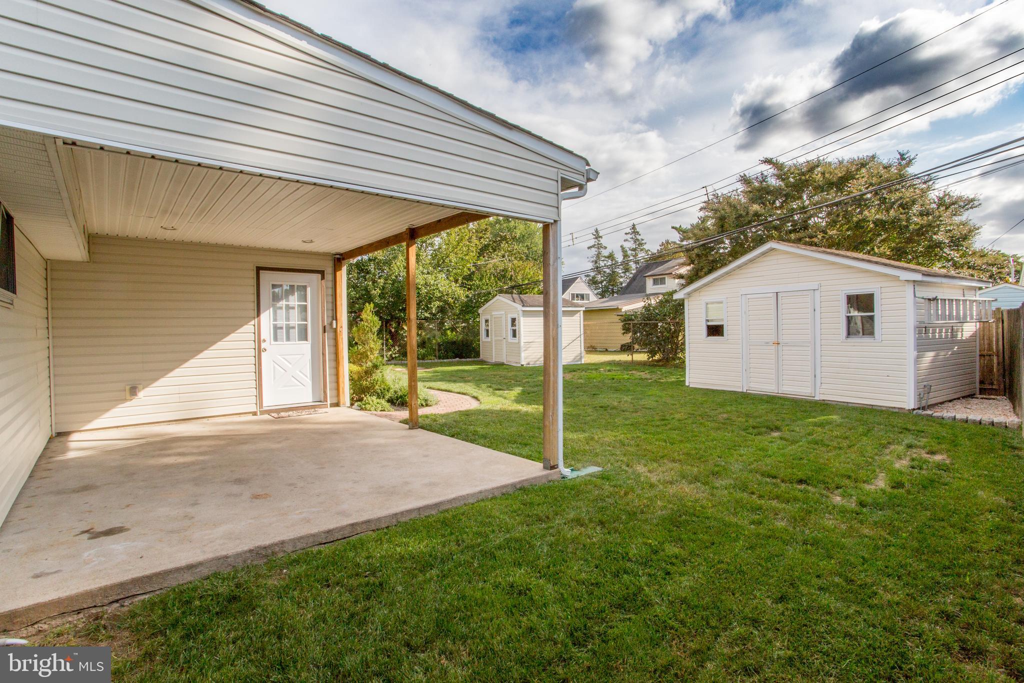 23 Misty Pine Road Levittown, PA 19056 - Photo 58 of 74 a view of a backyard with plants and large tree