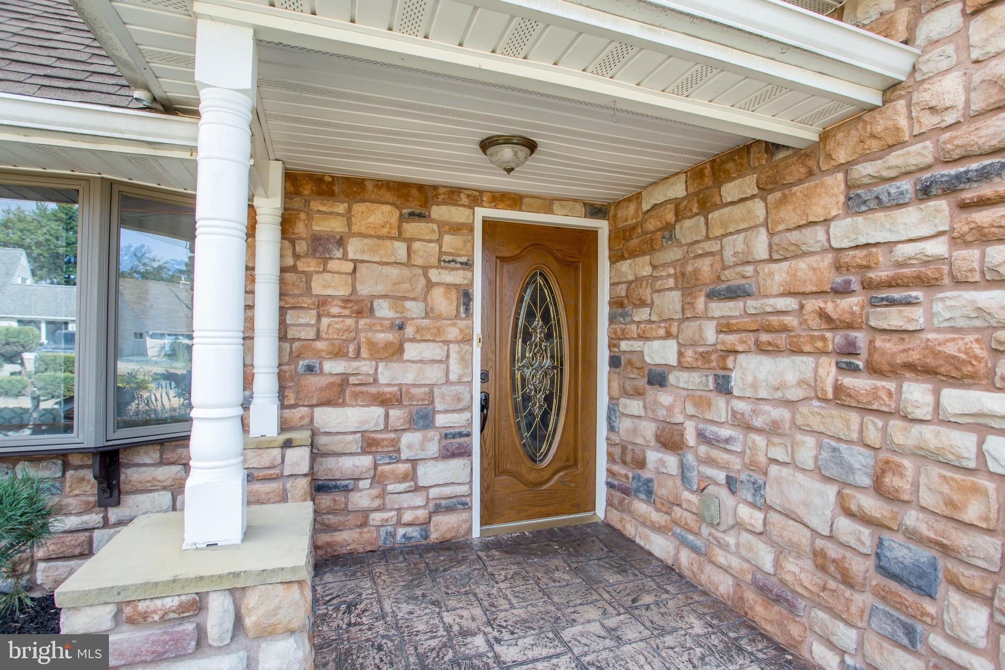 23 Misty Pine Road Levittown, PA 19056 - Photo 6 of 74 a front view of a house with a glass door