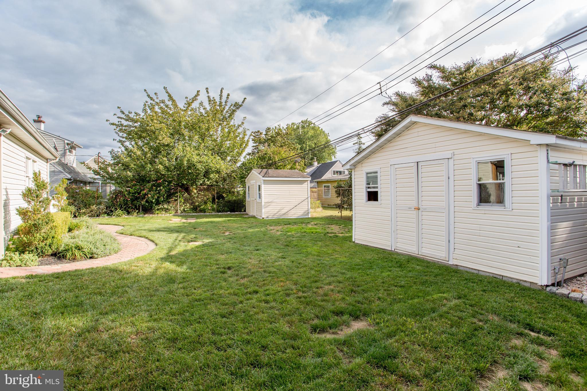 23 Misty Pine Road Levittown, PA 19056 - Photo 64 of 74 a view of a backyard with plants and a garden