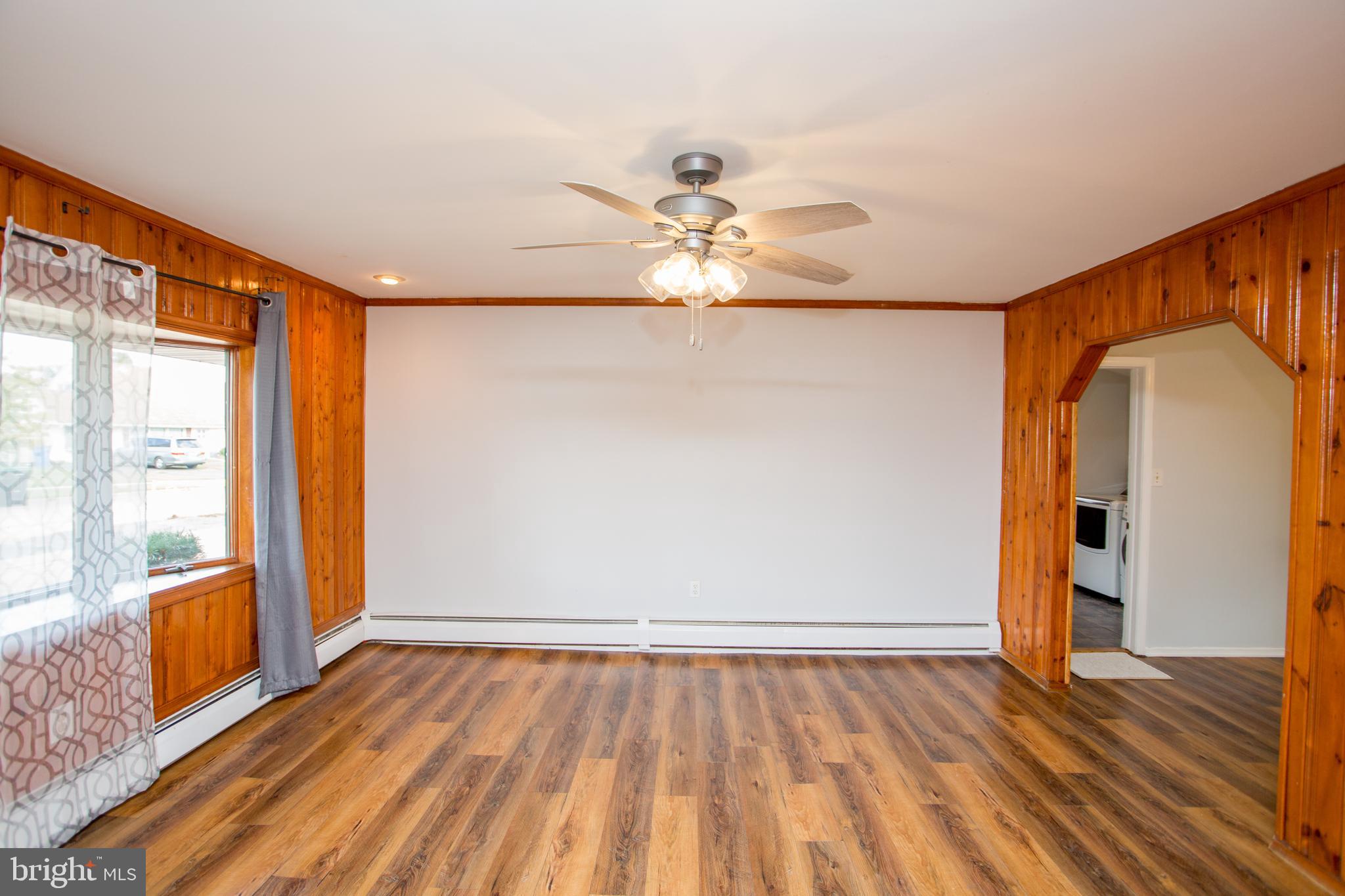 23 Misty Pine Road Levittown, PA 19056 - Photo 9 of 74 wooden floor in an empty room with a window
