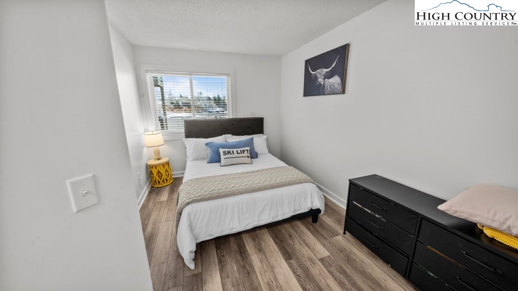 301 Pinnacle Inn Road, Unit 1114 Beech Mountain, NC 28604 - Photo 12 of 16 a bedroom with a bed and window