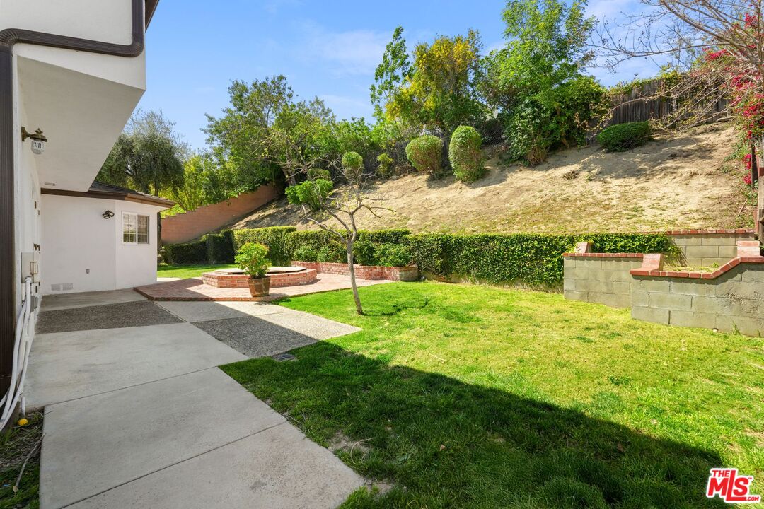 18657 Kirkcolm Lane Porter Ranch, CA 91326 - Photo 20 of 22 a view of a house with a yard