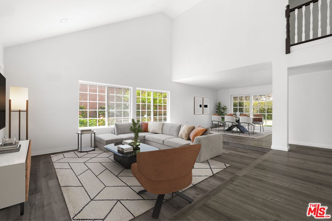 18657 Kirkcolm Lane Porter Ranch, CA 91326 - Photo 3 of 22 a living room with furniture and a large window