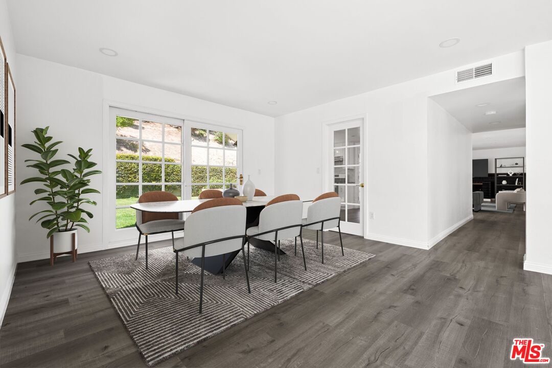 18657 Kirkcolm Lane Porter Ranch, CA 91326 - Photo 5 of 22 a dining room with furniture and wooden floor