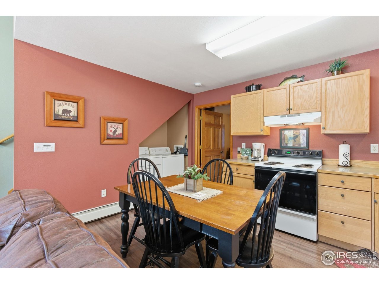 2120 Fall River Road, Unit 2 Estes Park, CO 80517 - Photo 11 of 28 a view of a kitchen with a dining table and chairs