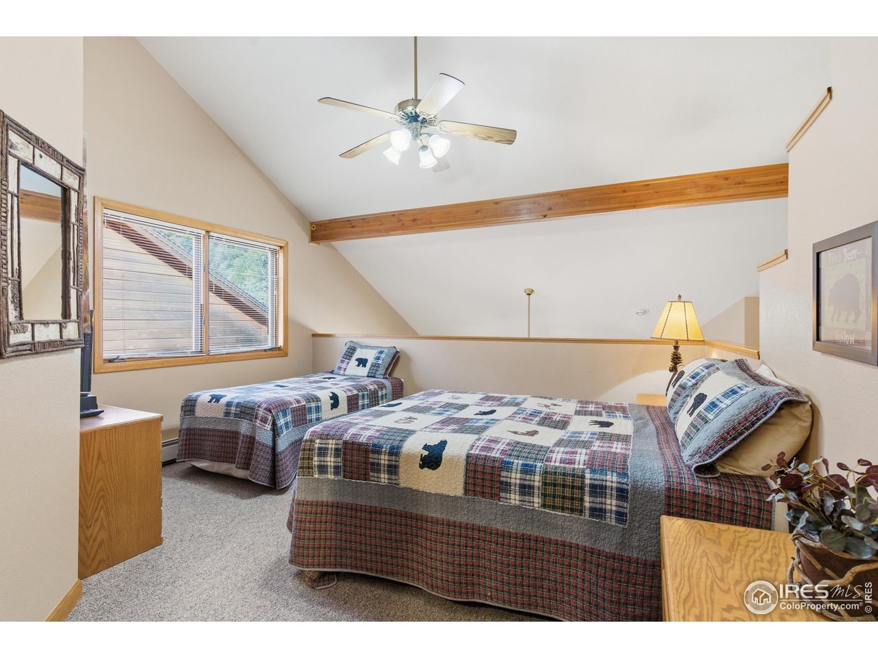 2120 Fall River Road, Unit 2 Estes Park, CO 80517 - Photo 19 of 28 a bedroom with a bed and window