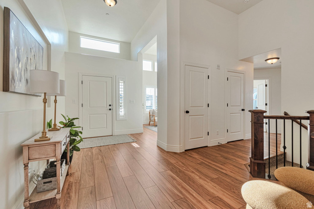 1288 North Horizon View Loop Elk Ridge, UT 84651 - Photo 13 of 40 Entrance foyer with a high ceiling and light wood-style flooring
