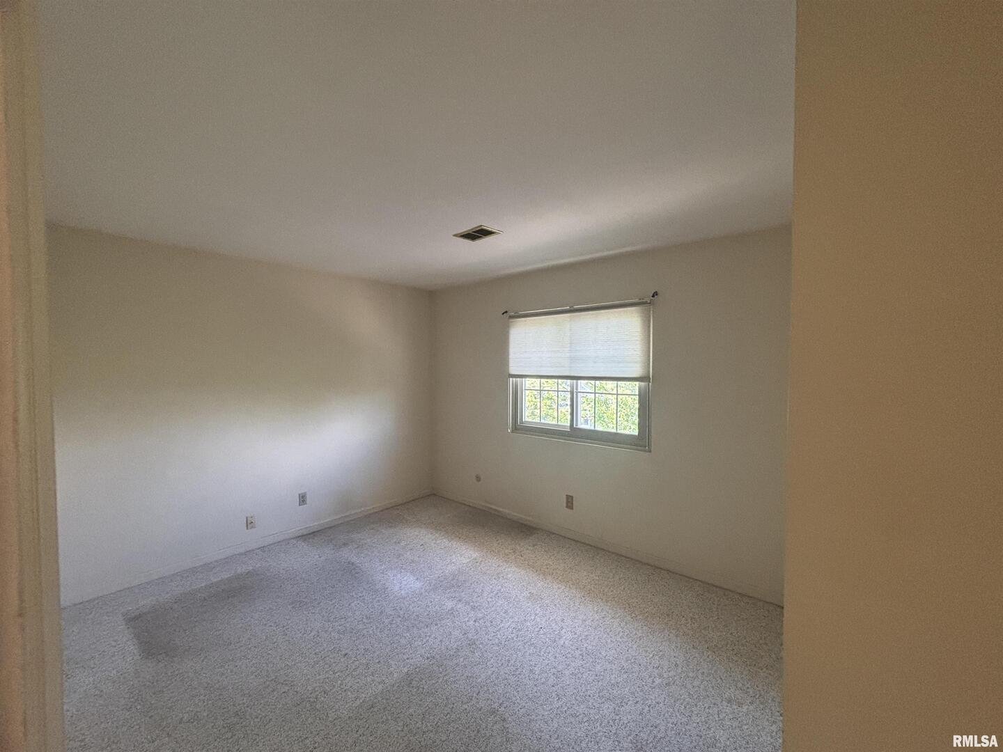920 17th Street, Unit 28 Moline, IL 61265 - Photo 12 of 17 an empty room with a window