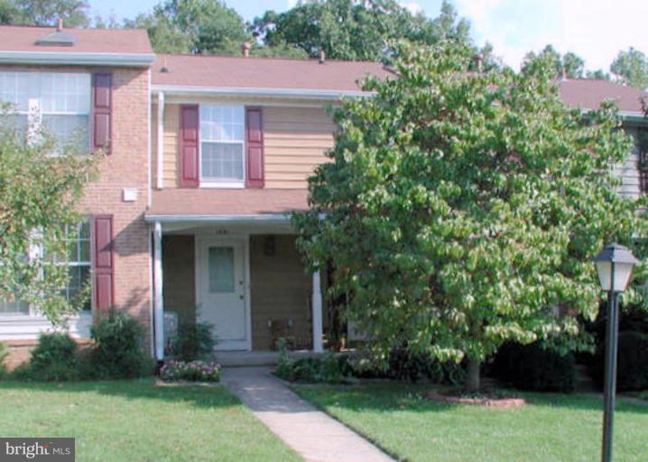 1491 Autumn Ridge Circle Reston, VA 20194 - Photo 1 of 20 a front view of a house with garden