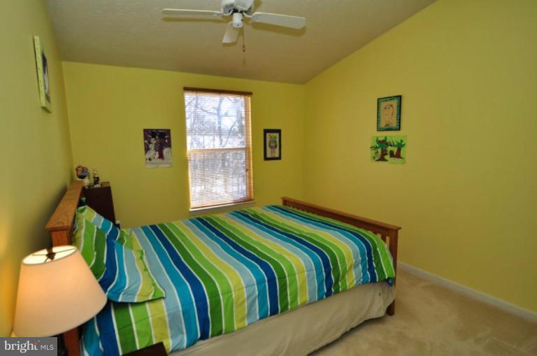 1491 Autumn Ridge Circle Reston, VA 20194 - Photo 14 of 20 a bedroom with a bed and painting on the wall