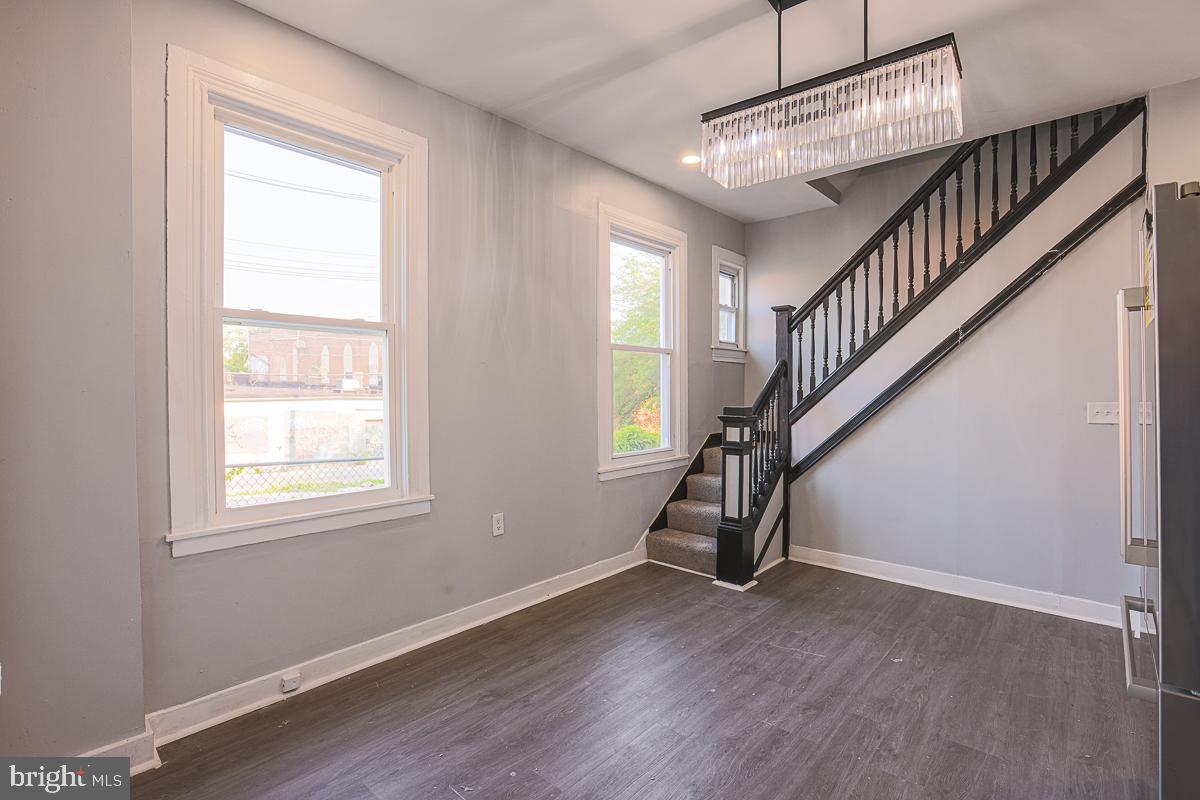 604 East 31st Street Baltimore, MD 21218 - Photo 26 of 50 a view of entryway and hall with wooden floor
